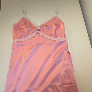 Pink satin dress with white bow details